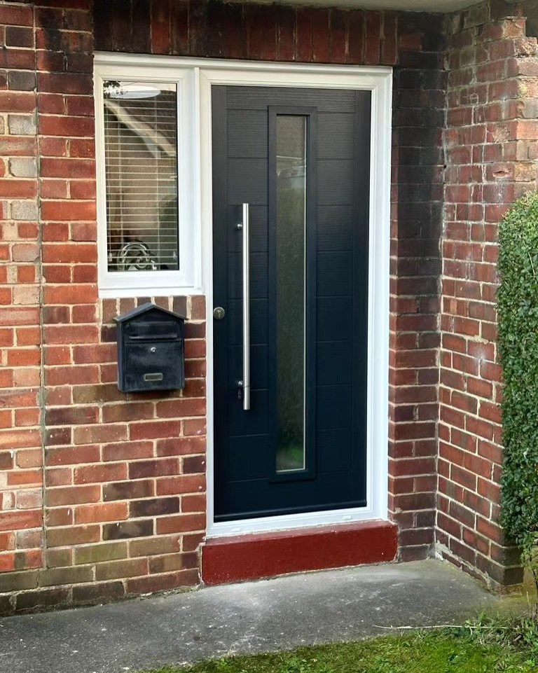 Black composite door with window after door installation upgrade