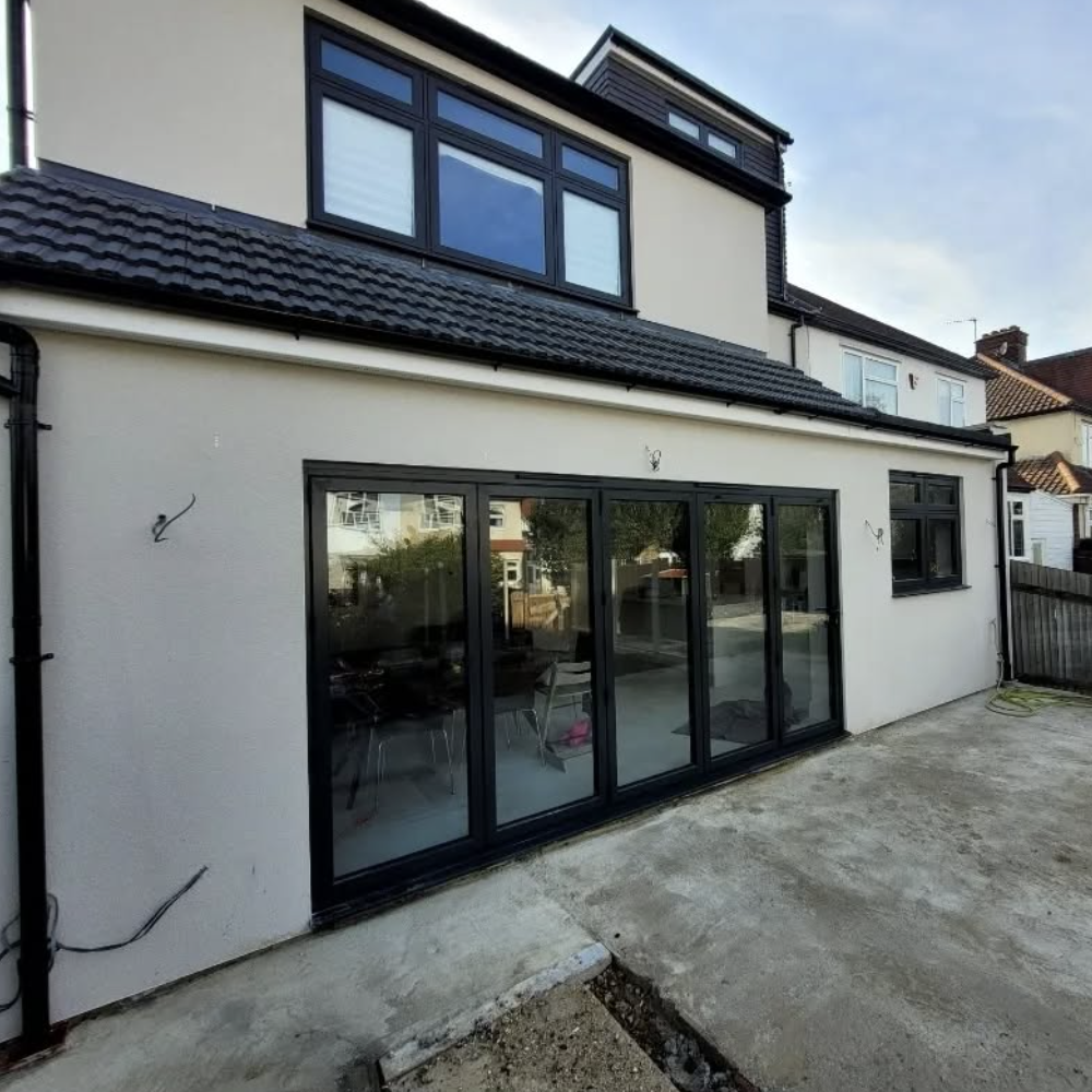 Sliding patio doors on a white house 