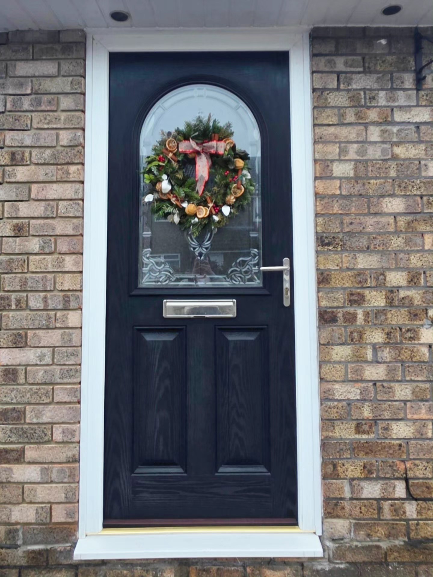 Composite door with wreath